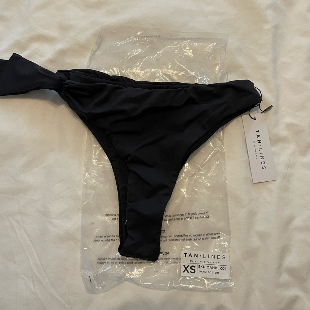 Tan + Lines swim black bottoms. Size XS. NWT. Cheeky and high waisted.